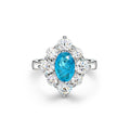 Oval shaped Paraíba blue sapphire set with cubic zirconia in a 925 sterling silver halo Ring