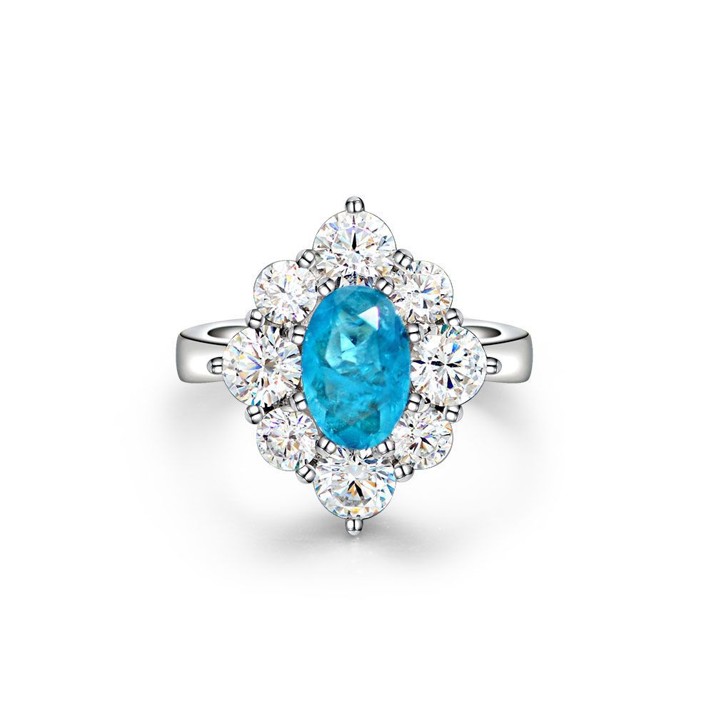 Oval shaped Paraíba blue sapphire set with cubic zirconia in a 925 sterling silver halo Ring