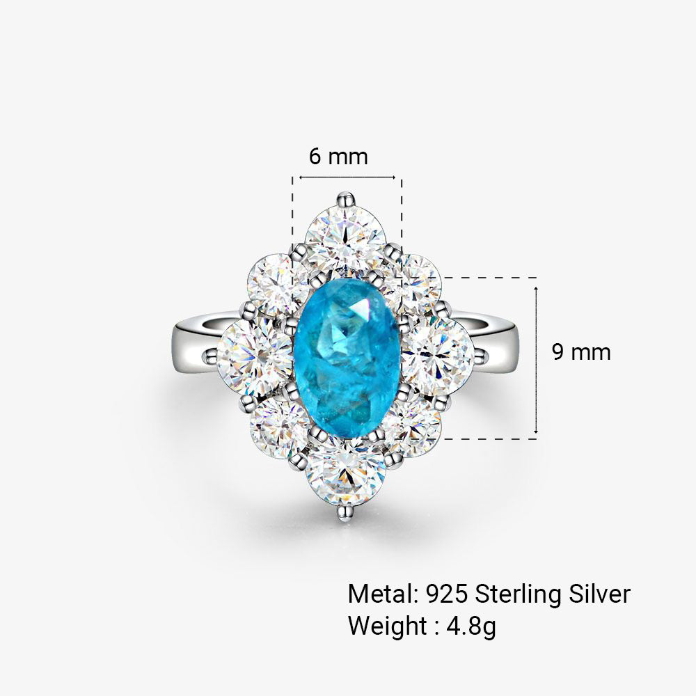 Oval shaped Paraíba blue sapphire set with cubic zirconia in a 925 sterling silver halo Ring
