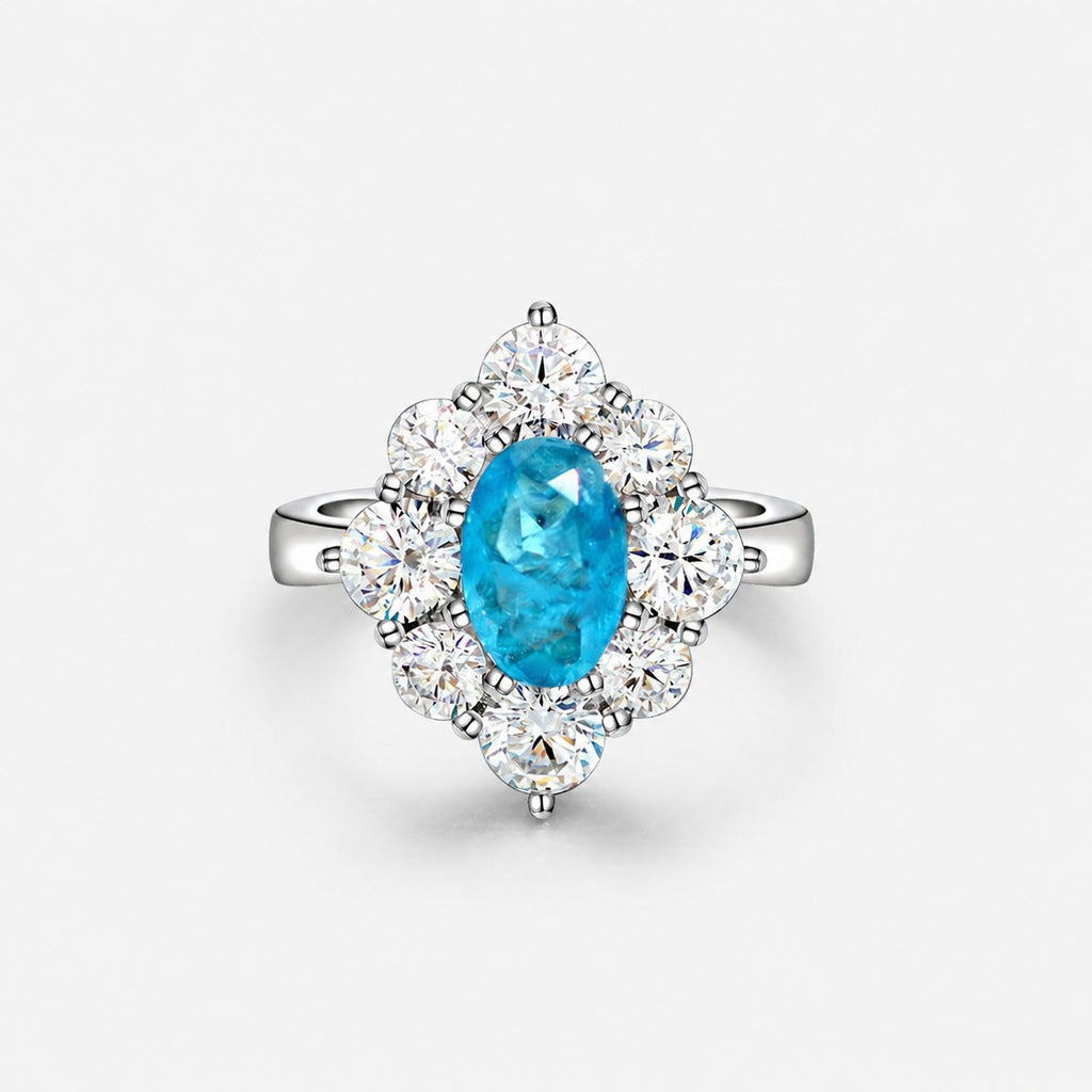 Oval shaped Paraíba blue sapphire set with cubic zirconia in a 925 sterling silver halo Ring