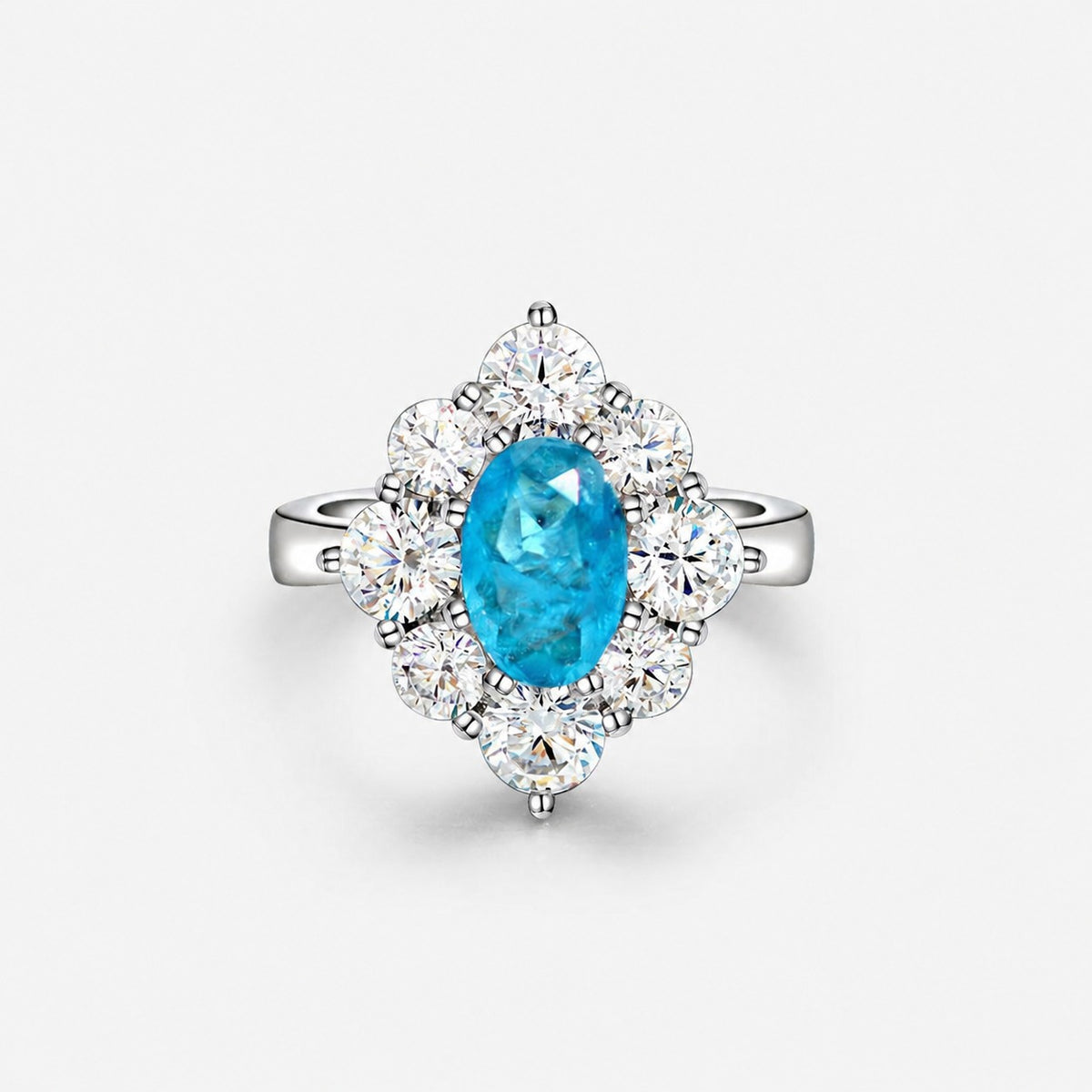 Oval shaped Paraíba blue sapphire set with cubic zirconia in a 925 sterling silver halo Ring